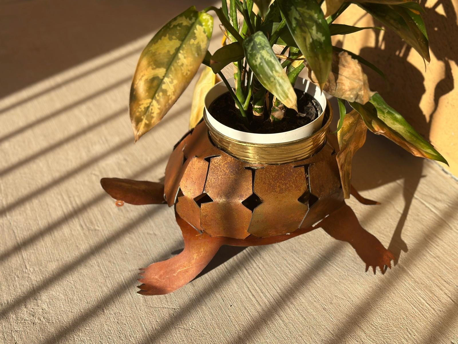 Rusted steel desert tortoise planter holder