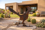 Rusted metal roadrunner sculpture, standing pose