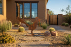Rusted metal roadrunner sculpture, standing pose