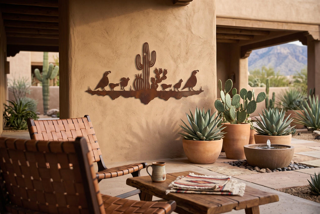 Rusted steel quail family and saguaro wall art on a stucco wall