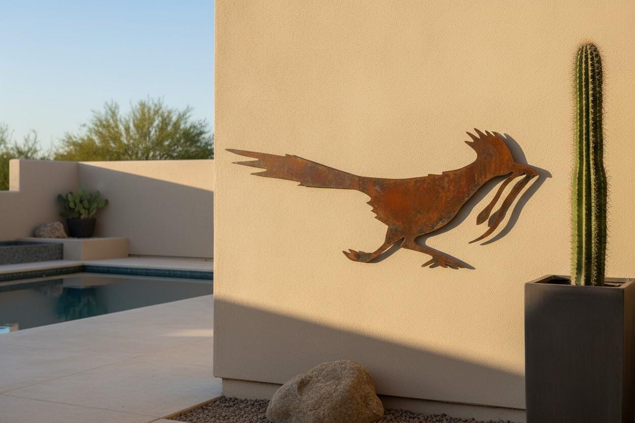 Wall Art collection - rusted iron roadrunner with snake wall art in a living room setting